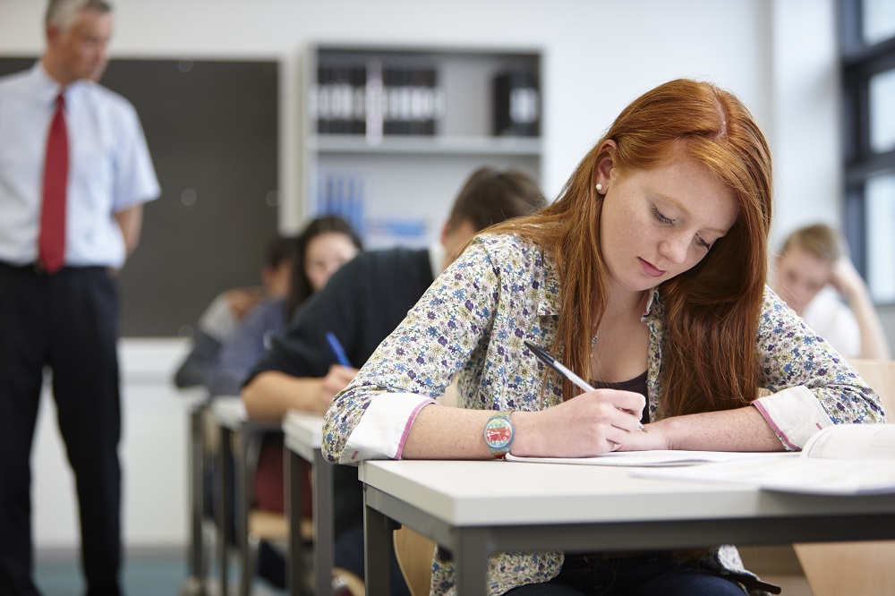 teacher watching over teenagers in classroom 2022 03 07 23 56 07 utc